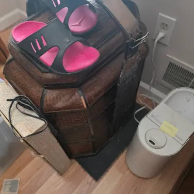 Sale Photo Thumbnail #113: Vintage Asian-style woven wicker and wood wedding basket with metal hardware, shown with a pair of pink and black slide sandals resting on top.