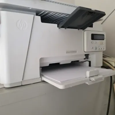 Sale Photo Thumbnail #89: HP LaserJet Pro MFP M26nw monochrome laser printer, showing light wear from use.