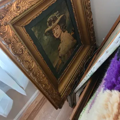 Sale Photo Thumbnail #46: Vintage oil painting portrait of a woman in a hat, housed in an ornate, heavily carved gilt wood frame.
