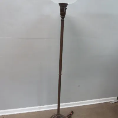 Sale Photo Thumbnail #31: Torchiere floor lamp featuring a dark bronze-finished metal pole and decorative base, topped with a frosted glass bowl shade.