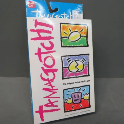 Sale Photo Thumbnail #10: Vintage Bandai Tamagotchi virtual reality pet in its original 1996-1997 packaging.