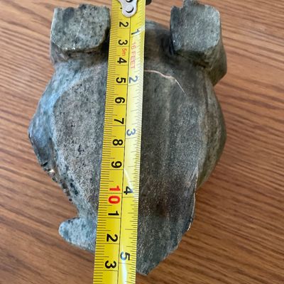 Sale Photo Thumbnail #56: A hand-carved decorative frog figurine crafted from a green stone, possibly soapstone or jadeite.