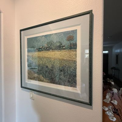 Framed print of Vincent van Gogh's "View of Arles with Irises in the Foreground," professionally matted under glass in a...