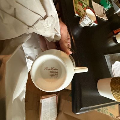 Mikasa bone china teacup in the Chippendale pattern, showing the maker's mark on the underside.