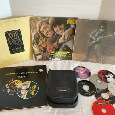 Four Vintage Albums and a CD Case With Music and Movies in it