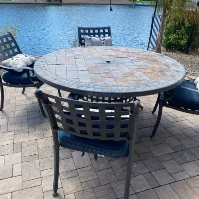 Large Round Stone Top Outdoor Table and Four Chairs