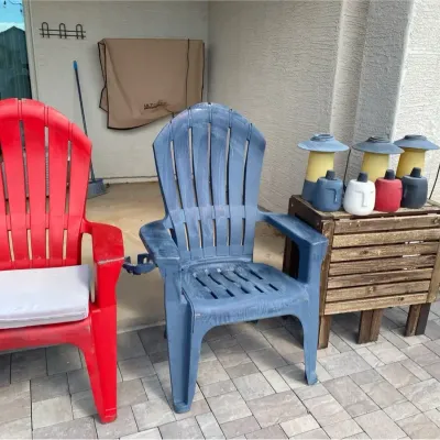 Two Resin Chairs, a Table, and Some Oil Lamps