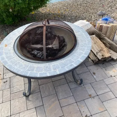 Metal Outdoor Fireplace and Wood to Go With It