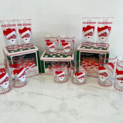 Sale Photo Thumbnail #237: Vintage Russ Berrie acrylic Christmas tumbler sets featuring a retro Santa Claus graphic, including 16 oz tall tumblers and 14 oz double old fashioned glasses in their original boxes.
