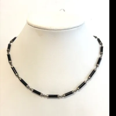 Sale Photo Thumbnail #166: Vintage sterling silver and black onyx bar link necklace, featuring cylindrical onyx segments capped in silver on a delicate chain.