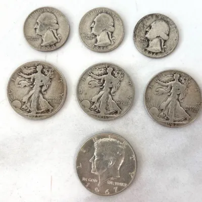 Sale Photo Thumbnail #323: Collection of vintage US silver coins, including three Washington quarters (1954, 1936, 1936), three Walking Liberty half dollars (1923, 1936, 1942), and one 1967 Kennedy half dollar.