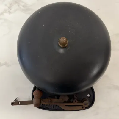 Sale Photo Thumbnail #88: Vintage Bevin Brothers mechanical door bell featuring a black metal dome and cast iron pull mechanism.