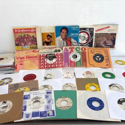 Sale Photo Thumbnail #191: Collection of vintage 45 RPM vinyl records, featuring soul, R&B, and pop artists including Sam Cooke, Yma Sumac, and releases on labels like Gordy, Atlantic, ATCO, and Excello.