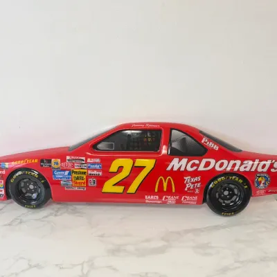 Sale Photo Thumbnail #214: Vintage Jimmy Spencer #27 McDonald's NASCAR plastic toy stock car, featuring authentic sponsor decals including Goodyear, DieHard, and Texas Pete.
