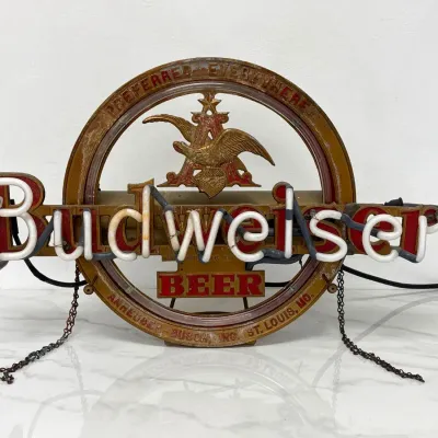 Sale Photo Thumbnail #311: Vintage Budweiser neon beer sign featuring the classic Anheuser-Busch A-and-Eagle logo, showing some age-appropriate wear and patina.