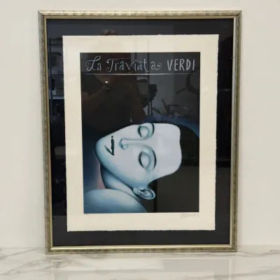 Sale Photo Thumbnail #297: Framed and matted opera poster print for Giuseppe Verdi's La Traviata, featuring surrealist artwork with a silver-toned frame.