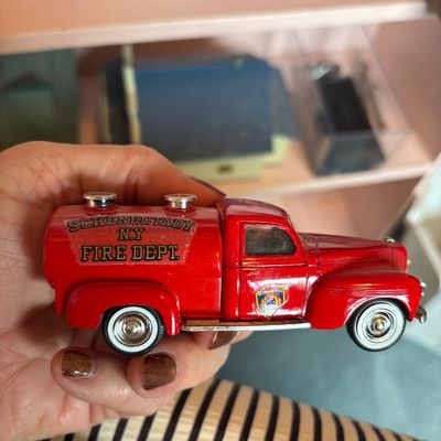Vintage die-cast toy fire truck tanker labeled for the Schenectady N.Y. Fire Dept., featuring whitewall tires and chrome accents.