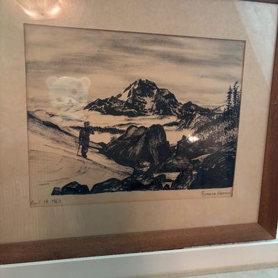 Framed black and white landscape print by Ramona Hammerly, dated April 19, 1963, depicting a hiker in a mountainous terrain.