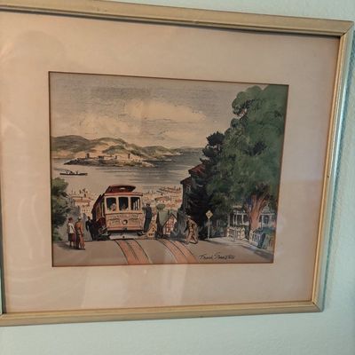 Framed and matted print by Frank Smeaton depicting a San Francisco cable car on Hyde Street with Alcatraz Island in the background.