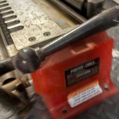 Porter-Cable Model 7116 Omnijig 24-inch dovetail jig, showing some wear and dust from workshop use.