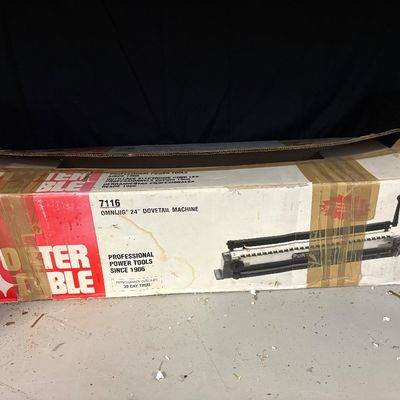Porter-Cable 7116 Omnijig 24-inch dovetail machine in its original, worn cardboard box.