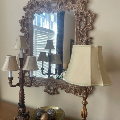 Sale Photo Thumbnail #62: Ornate Rococo-style carved wall mirror in a champagne finish