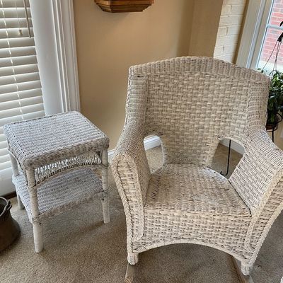 Sale Photo Thumbnail #15: Vintage white wicker rocking chair featuring braided trim details, paired with a matching two-tier wicker side table. Pieces are priced separately.