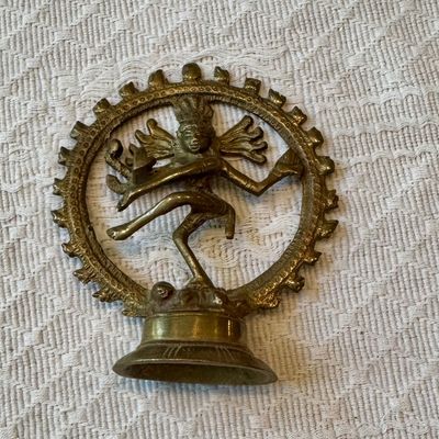 Sale Photo Thumbnail #43: Vintage brass Shiva Nataraja dancing statue featured on a bell base, displaying detailed metalwork and a naturally aged patina.
