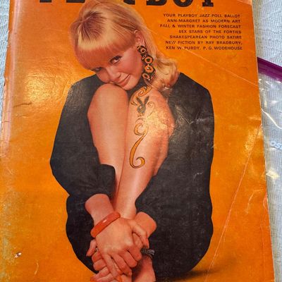 Sale Photo Thumbnail #45: October 1966 issue of Playboy magazine featuring a vibrant orange cover, showing light edge and corner wear.