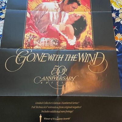 Sale Photo Thumbnail #78: Folded theatrical movie poster for the 1989 50th Anniversary release of Gone With the Wind, featuring classic artwork of Clark Gable and Vivien Leigh.