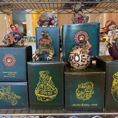 Sale Photo Thumbnail #131: Collection of vintage Boyds Bears & Friends resin Christmas ornaments displayed with their original green boxes.