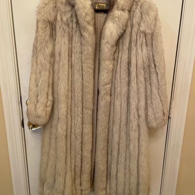 Sale Photo Thumbnail #175: Vintage full-length light gray fox fur coat featuring a wide shawl collar, vertical pelting, and a silk lining