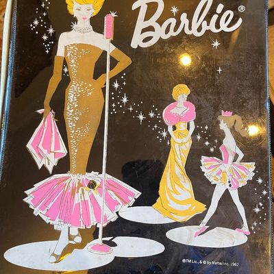 Sale Photo Thumbnail #122: Vintage 1962 Mattel Barbie vinyl binder case featuring illustrations of Barbie in various glamour outfits.