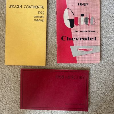 Sale Photo Thumbnail #84: Set of three vintage automobile manuals, including a 1972 Lincoln Continental owner's manual, a 1957 Chevrolet guide, and a 1968 Mercury registered owner's manual.