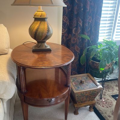 Sale Photo Thumbnail #5: French Provincial oval two-tier side table on caster feet.