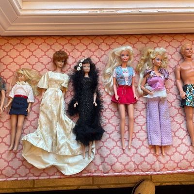 Sale Photo Thumbnail #123: Collection of seven vintage Barbie and Ken dolls in various outfits, ranging from the 1960s to 1980s.