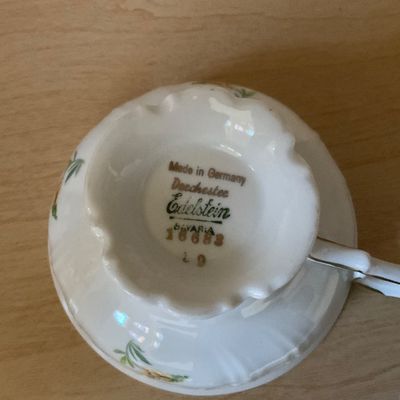 Sale Photo Thumbnail #68: Underside of an Edelstein Bavaria porcelain teacup in the Dorchester pattern, showing the maker's mark and gold-stamped pattern number 18683.