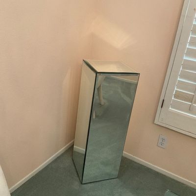 Sale Photo Thumbnail #3: Modern mirrored pedestal stand, featuring a rectangular column design with beveled glass panels.
