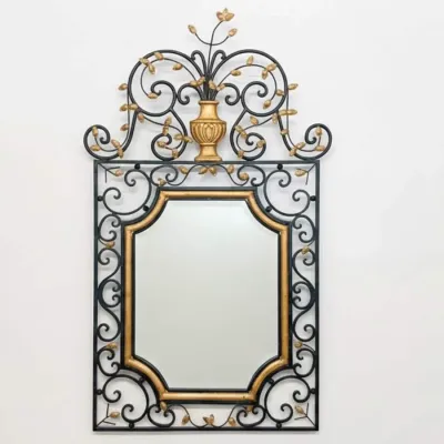 Sale Photo Thumbnail #68: Vintage wrought iron wall mirror featuring an ornate black scrollwork frame with gold-gilded leaf accents and a decorative urn crest.