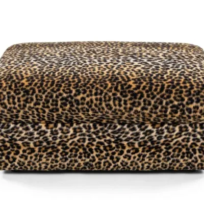 Sale Photo Thumbnail #17: Rectangular upholstered ottoman featuring a bold leopard print fabric with a plush, cushioned top.