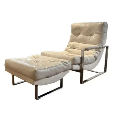 Sale Photo Thumbnail #8: Mid-century modern lounge chair and matching ottoman with tufted cream leather upholstery and chrome frames.