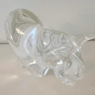 Sale Photo Thumbnail #25: Vintage hand-blown clear art glass bull figurine, depicting a charging bull with detailed horns and muscular form.