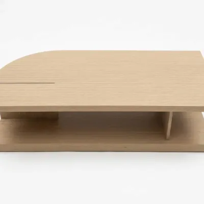 Sale Photo Thumbnail #29: Minimalist light oak coffee table featuring a two-tier design with an asymmetrical curved top and built-in lower shelf.