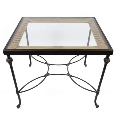 Sale Photo Thumbnail #66: Neoclassical style square side table featuring a dark metal frame with curved stretchers, fluted legs, and a glass top revealing a gold-painted reed border.