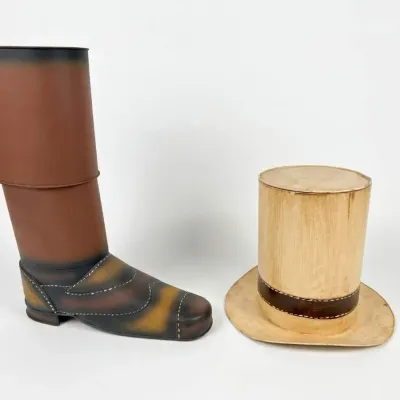Sale Photo Thumbnail #7: Vintage painted metal boot umbrella stand paired with a rustic wooden top hat decorative container.