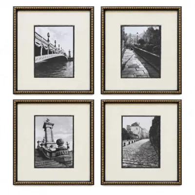 Sale Photo Thumbnail #32: Set of four framed black and white photographs depicting European architectural scenes, presented in matching dark frames with beaded gold inner borders and cream matting.