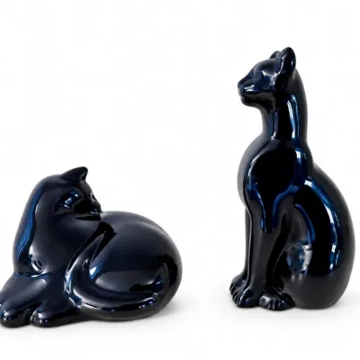 Sale Photo Thumbnail #13: Pair of vintage mid-century modern ceramic cat figurines in a glossy, deep cobalt blue glaze, featuring one sitting and one reclining cat.