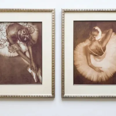 Sale Photo Thumbnail #31: Pair of framed sepia-toned ballerina prints, matted and housed in matching silver-gilt fluted frames.