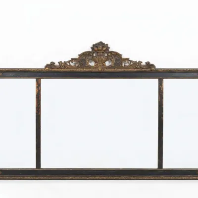 Sale Photo Thumbnail #3: Antique three-panel overmantel mirror featuring a black and gold painted frame with an ornate carved urn pediment.
