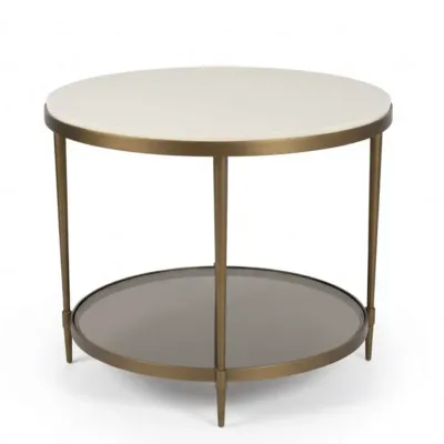 Sale Photo Thumbnail #82: Modern round end table featuring a white stone top, a brass-finished metal frame, and a smoked glass lower shelf.